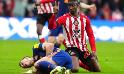 Newcastle star Dan Burn 'rushed to hospital with breathing difficulties' after going off with rib injury at Sunderland