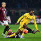 TURIN, ITALY - DECEMBER 08: Rafael Leao of AC Milan is challenged by Guillermo Maripan of Torino during the Serie A match between Torino FC and AC Milan at Stadio Olimpico di Torino on December 08, 2025 in Turin, Italy. (Photo by Valerio Pennicino/Getty Images)