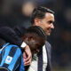 BERGAMO, ITALY - NOVEMBER 30: Raffaele Palladino, Head Coach of Atalanta BC embraces with Kamaldeen Sulemana of Atalanta BC following the team