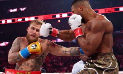 Anthony Joshua knocks out Jake Paul after dropping YouTuber multiple times in controversial boxing match
