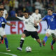 DORTMUND, GERMANY - MARCH 23: Jamal Musiala of Germany is challenged by Nicolo Barella (R) and Samuele Ricci of Italy during the UEFA Nations League Quarterfinal Leg Two match between Germany and Italy at Football Stadium Dortmund on March 23, 2025 in Dortmund, Germany. (Photo by Alex Grimm/Getty Images)