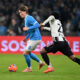 NAPLES, ITALY - DECEMBER 07: Scott McTominay of SSC Napoli on the ball whilst under pressure from Weston McKennie of Juventus during the Serie A match between SSC Napoli and Juventus FC at Stadio Diego Armando Maradona on December 07, 2025 in Naples, Italy. (Photo by Francesco Pecoraro/Getty Images)