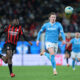 RIYADH, SAUDI ARABIA - DECEMBER 18: Scott McTominay of SSC Napoli battles for possession with Youssouf Fofana of AC Milan during the Supercoppa Italiana Semi-Final match between SSC Napoli and AC Milan at King Saud University Stadium on December 18, 2025 in Riyadh, Saudi Arabia. (Photo by Abdullah Ahmed/Getty Images)