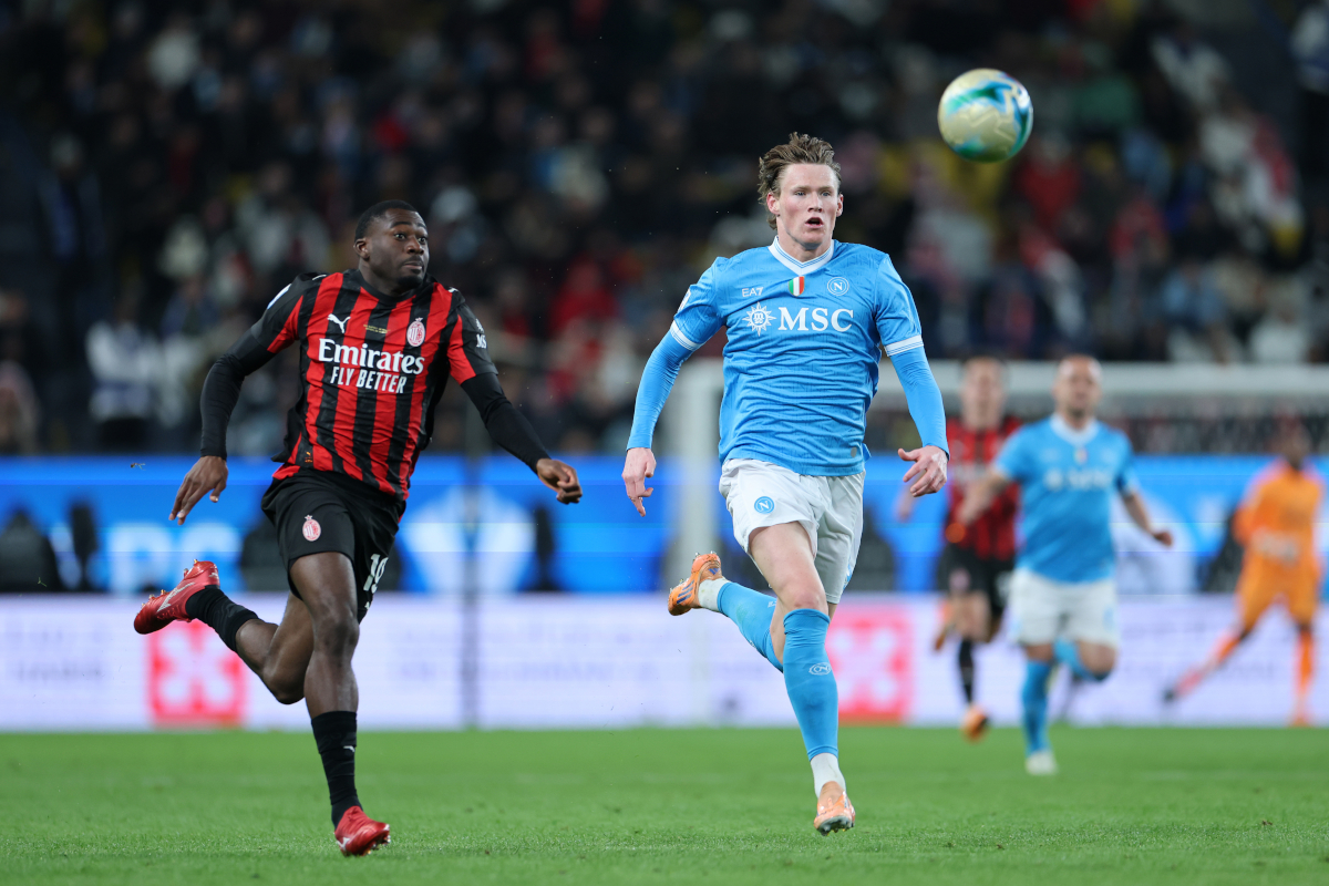RIYADH, SAUDI ARABIA - DECEMBER 18: Scott McTominay of SSC Napoli battles for possession with Youssouf Fofana of AC Milan during the Supercoppa Italiana Semi-Final match between SSC Napoli and AC Milan at King Saud University Stadium on December 18, 2025 in Riyadh, Saudi Arabia. (Photo by Abdullah Ahmed/Getty Images)