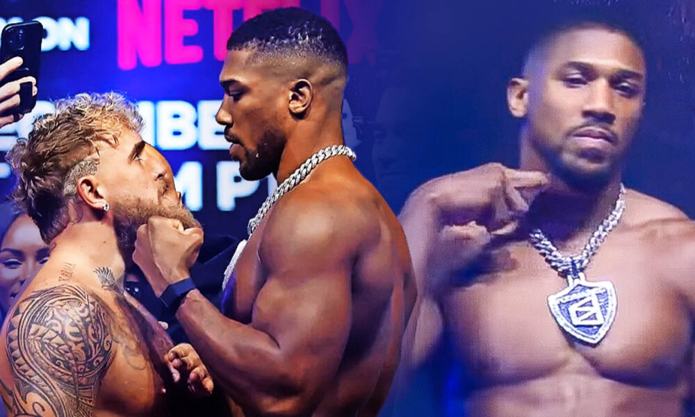 Anthony Joshua makes slitting throat gesture to Jake Paul after almost coming to blows in face off ahead of Netflix bout
