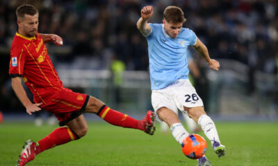 ROME, ITALY - NOVEMBER 23: Toma Basic of Lazio shoots past Ylber Ramadani of Lecce during the Serie A match between SS Lazio and US Lecce at Stadio Olimpico on November 23, 2025 in Rome, Italy. (Photo by Paolo Bruno/Getty Images)