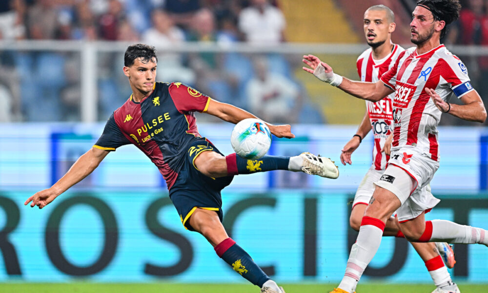 GENOA, ITALY - AUGUST 15: Valentin Carboni of Genoa (left) scores the opening goal during the Coppa Italia match between Genoa CFC and LR Vicenza at Stadio Luigi Ferraris on August 15, 2025 in Genoa, Italy. (Photo by Simone Arveda/Getty Images)
