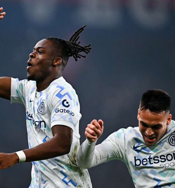 GENOA, ITALY - DECEMBER 14: Yann Bisseck of Inter (left) celebrates with his team-mate Lautaro Martinez after scoring a goal during the Serie A match between Genoa CFC and FC Internazionale at Luigi Ferraris Stadium on December 14, 2025 in Genoa, Italy. (Photo by Simone Arveda/Getty Images)