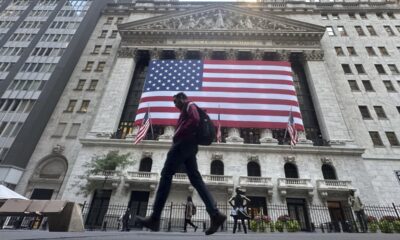 Wall Street hits record highs, Oracle shares tumble