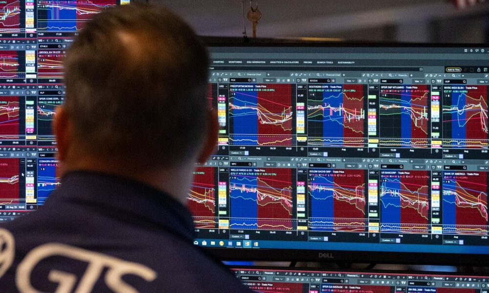 Wall St ends lower as yields climb, crypto stocks drop