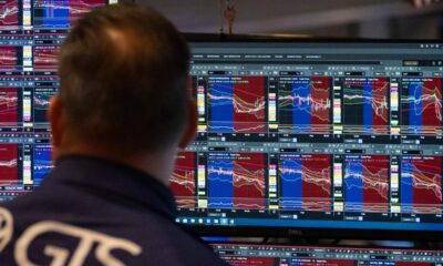 Wall St ends lower as yields climb, crypto stocks drop