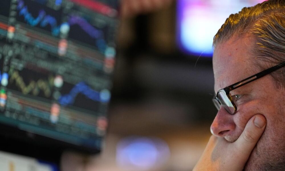 Wall St closes lower as investors position for key data