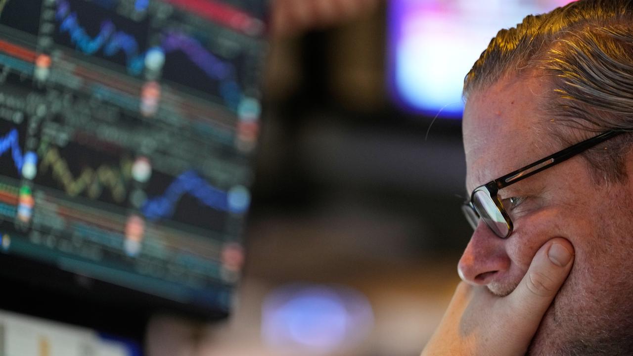 Wall St closes lower as investors position for key data
