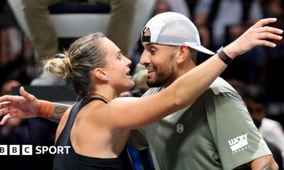 Aryna Sabalenka and Nick Kyrgios hug at the net