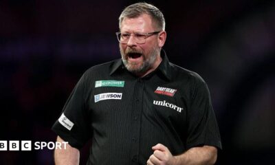 James Wade celebrates