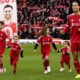 Virgil van Dijk of Liverpool enters the pitch with the children of former player Diogo Jota prior to the Premier League match between Liverpool and Wolves