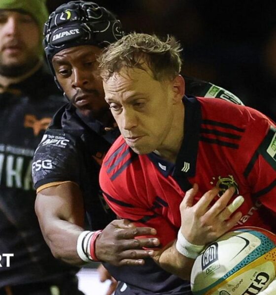 Mike Haley is tackle by Daniel Kasende