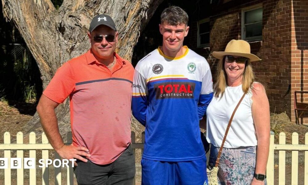Josh Baker, centre, with his parents Paul and Lisa