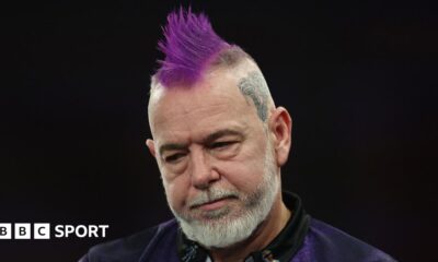 Arno Merk and Peter Wright embrace