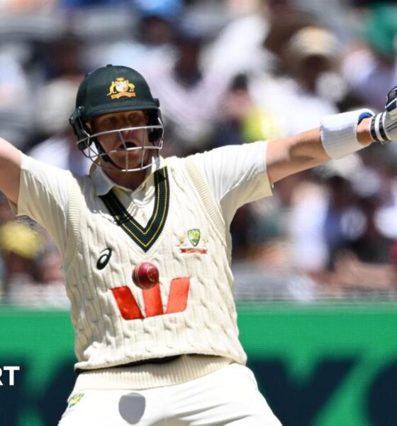 Melbourne Cricket Ground head groundsman Matt Page (left) inspects the pitch during the lunch break on day two of the fourth Ashes Test