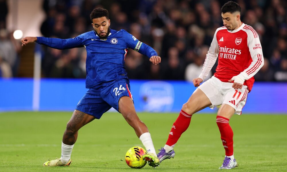 Reece James of Chelsea is challenged by Gabriel Martinelli of Arsenal