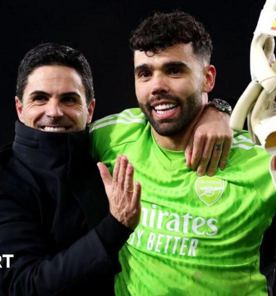Mikel Arteta, Manager of Arsenal, and David Raya of Arsenal embrace at full-time after victory in the penalty shoot out following the UEFA Champions League 2023/24 round of 16 second leg match between Arsenal FC and FC Porto at Emirates Stadium on March 12, 2024