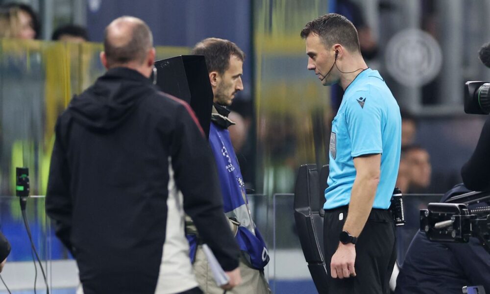 MILAN, ITALY - DECEMBER 09: Referee Felix Zwayer, consults the VAR screen before declaring the goal scored by Ibrahima Konate of Liverpool (not pictured) disallowed for a handball during the UEFA Champions League 2025/26 League Phase MD6 match between FC Internazionale Milano and Liverpool FC at Stadio San Siro on December 09, 2025 in Milan, Italy. (Photo by Justin Setterfield/Getty Images)
