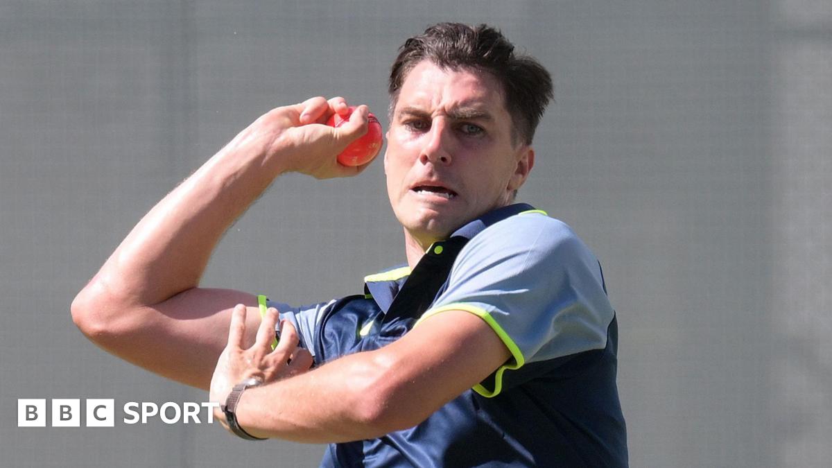 Pat Cummins bowls during practice