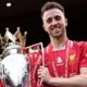 Diogo Jota holding the Premier League trophy while playing for Liverpool in May