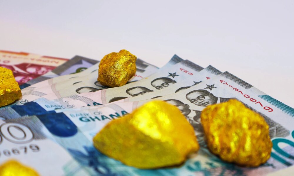 Ghanaian cedi notes and Lump of pure Gold on white background. Raw golden metal ore, galamsey minning wealthy rich precious mineral