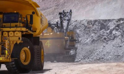 Heavy mining machinery extracting minerals in an open pit mine