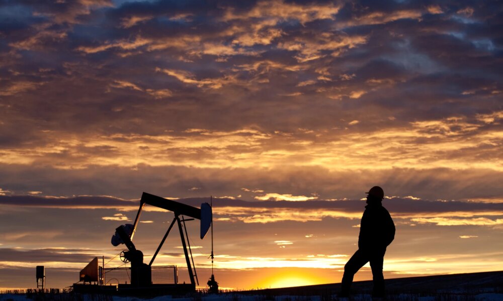 Oilfield Worker or Geologist at Sunrise by Pumpjack