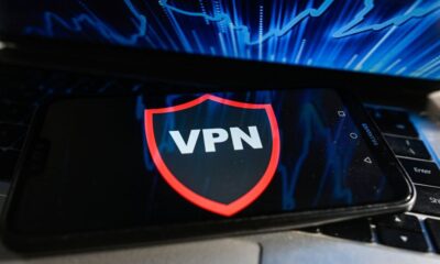 A VPN runs on a mobile phone placed on a laptop keyboard
