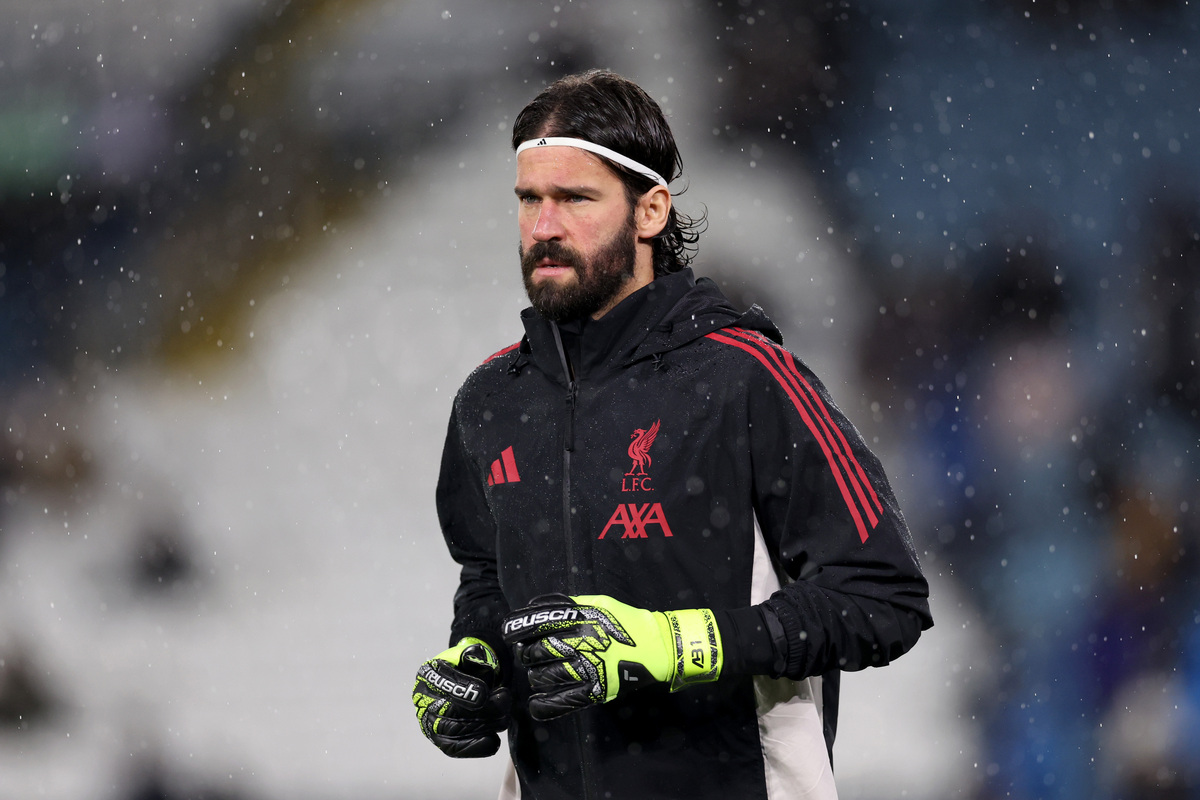 LEEDS, ENGLAND - DECEMBER 06: Alisson Becker of Liverpool warms up prior to the Premier League match between Leeds United and Liverpool at Elland Road on December 06, 2025 in Leeds, England. (Photo by Alex Livesey/Getty Images) (Salah)