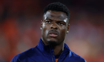 ROTTERDAM, NETHERLANDS - SEPTEMBER 04: Denzel Dumfries of Inter and the Netherlands stands for the national anthem prior to the FIFA World Cup 2026 qualifier match between Netherlands and Poland at De Kuip on September 04, 2025 in Rotterdam, Netherlands. (Photo by Dean Mouhtaropoulos/Getty Images)
