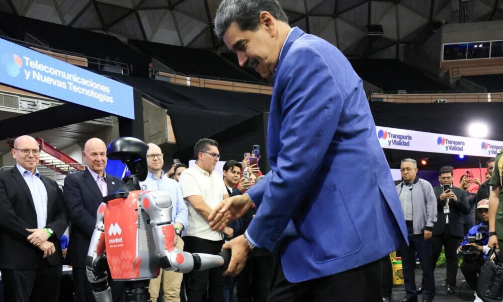 Awkward moment Venezuela tyrant Maduro salsas with robot as US flies special operations troops into Caribbean