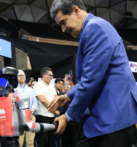 Awkward moment Venezuela tyrant Maduro salsas with robot as US flies special operations troops into Caribbean