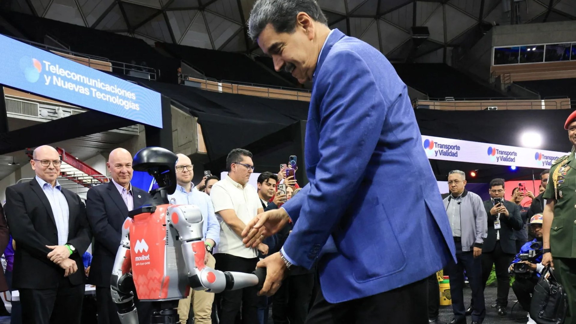 Awkward moment Venezuela tyrant Maduro salsas with robot as US flies special operations troops into Caribbean