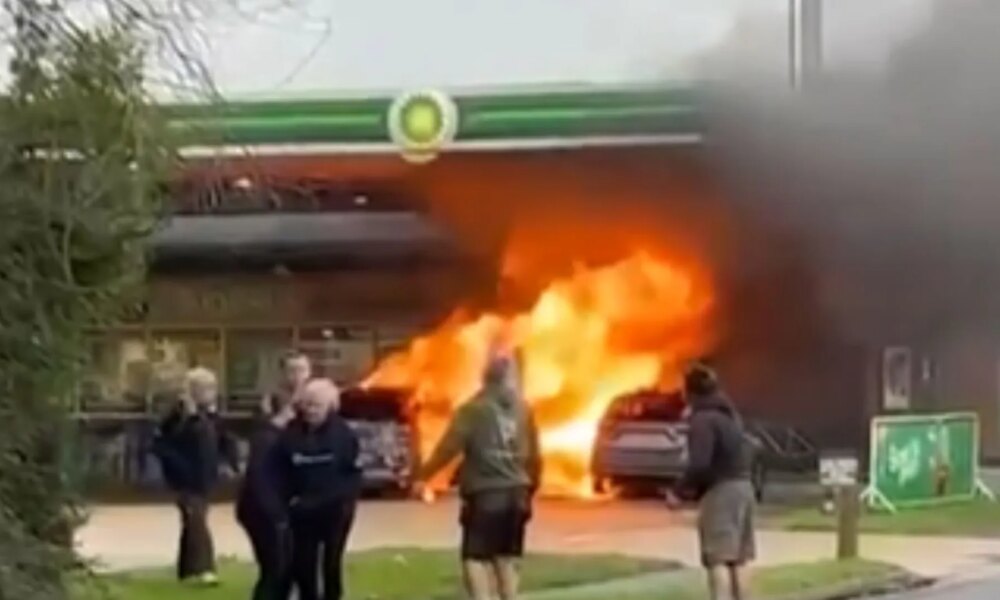 Huge fire erupts at BP petrol station engulfing two vehicles and pump as man seen on forecourt with axe before arrest