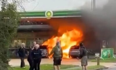 Huge fire erupts at BP petrol station engulfing two vehicles and pump as man seen on forecourt with axe before arrest