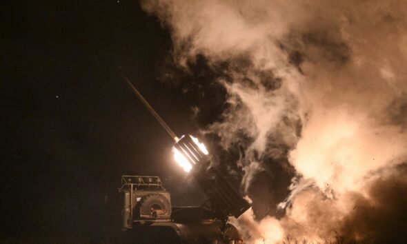 Service members of the 152nd Jaeger Brigade fire a BM-21 Grad multiple rocket launch system. Pic: Reuters