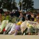 People leave flowers near the scene of the attack at Bondi Beach
