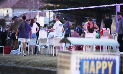 People and emergency workers after the incident on Bondi Beach. Pic: AP/Mark Baker