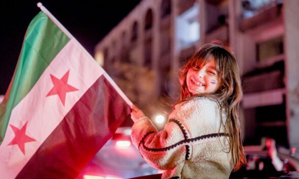Crowds gathered in Damascus early for Monday's celebrations.  Pic: AP