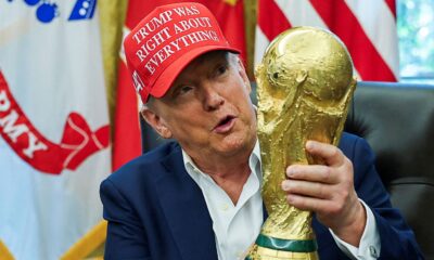 Donald Trump holds the World Cup trophy in August. Pic: Reuters