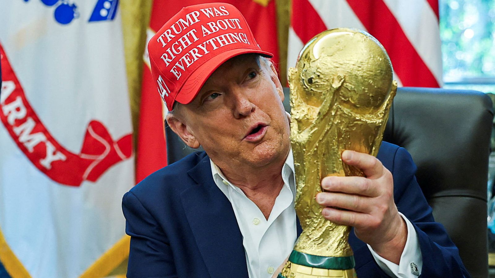 Donald Trump holds the World Cup trophy in August. Pic: Reuters