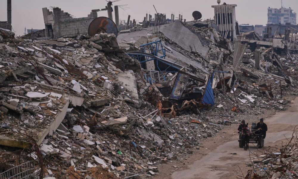 Palestinians pass along a street in Gaza City on Tuesday. Pic: AP