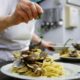 A chef prepares spaghetti alle vongole (spaghetti with clams) in Rome in 2021. File pic: Reuters