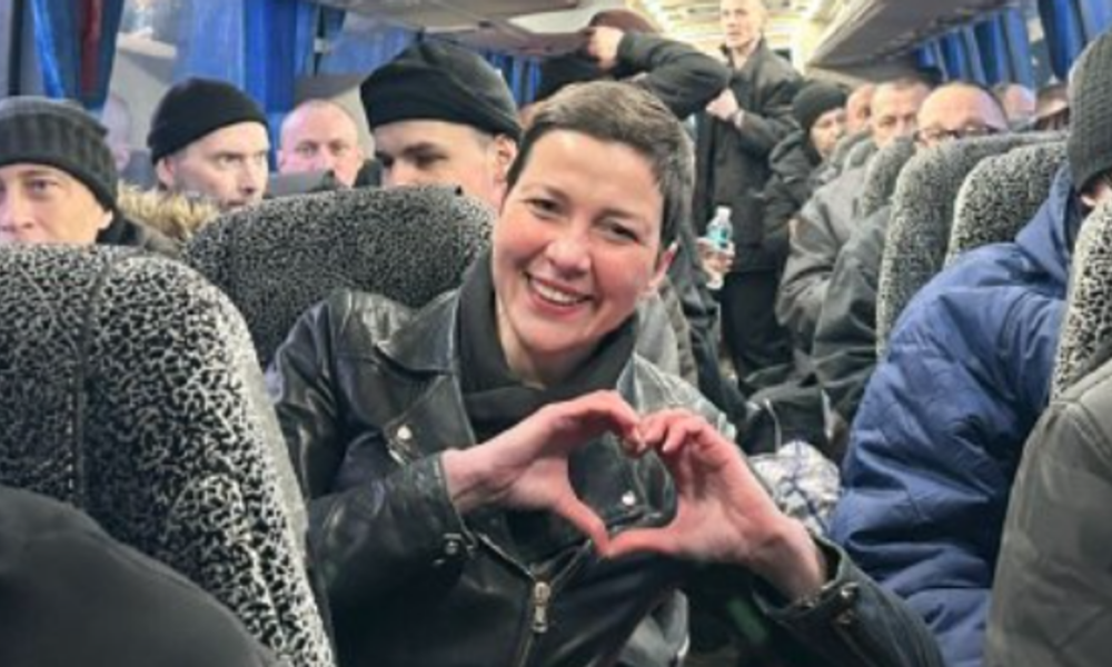 Maria Kolesnikova, making her trademark heart sign, on a coach with released prisoners arriving in Ukraine. Pic: Military Intelligence of Ukraine