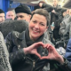 Maria Kolesnikova, making her trademark heart sign, on a coach with released prisoners arriving in Ukraine. Pic: Military Intelligence of Ukraine